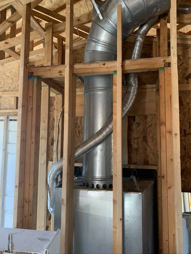 Advanced Fireplace Technician installing a prefab fireplace in Biloxi